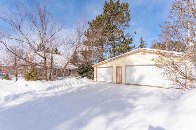 exterior space featuring a detached garage