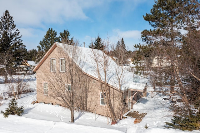 view of snow covered property