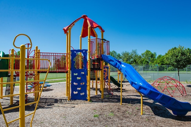 communal playground featuring fence