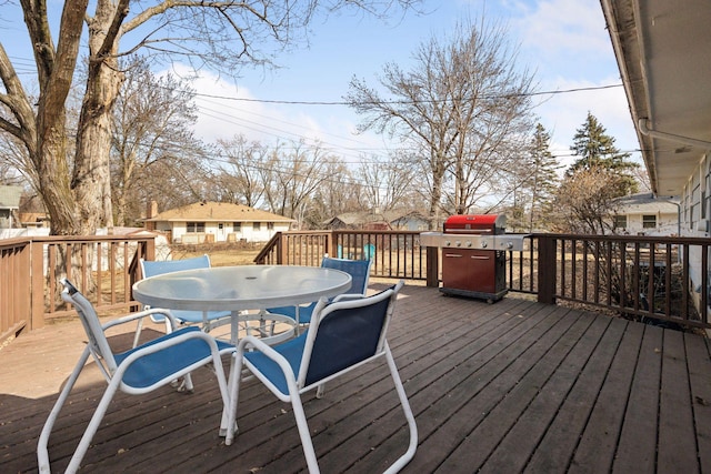 deck featuring outdoor dining area