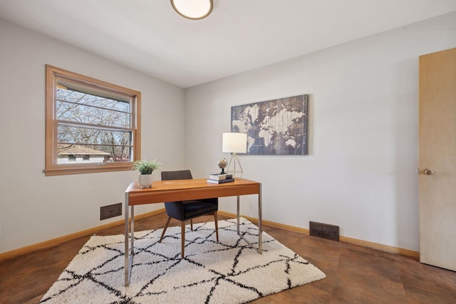 office space featuring visible vents, baseboards, and concrete flooring