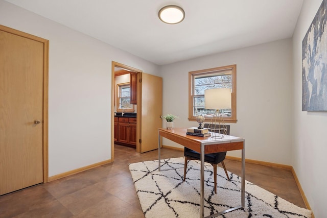 office area featuring baseboards