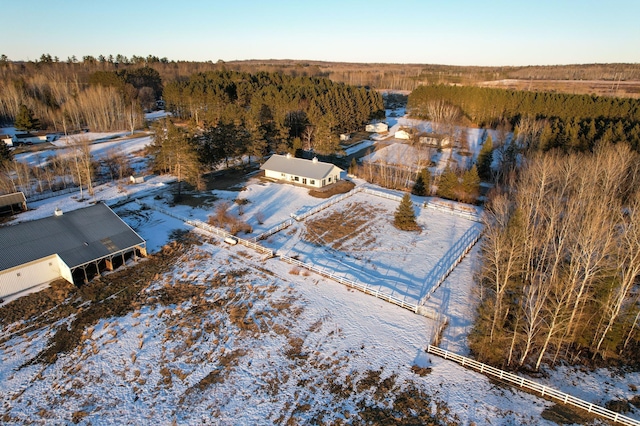 birds eye view of property featuring a view of trees