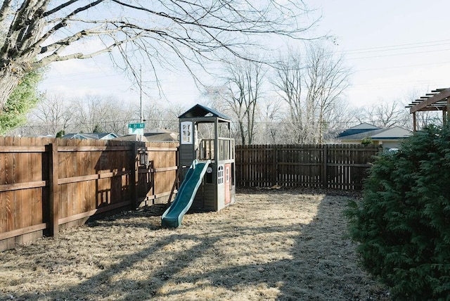 view of jungle gym with a fenced backyard