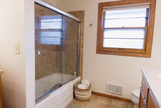 bathroom with baseboards, visible vents, toilet, tile patterned flooring, and vanity