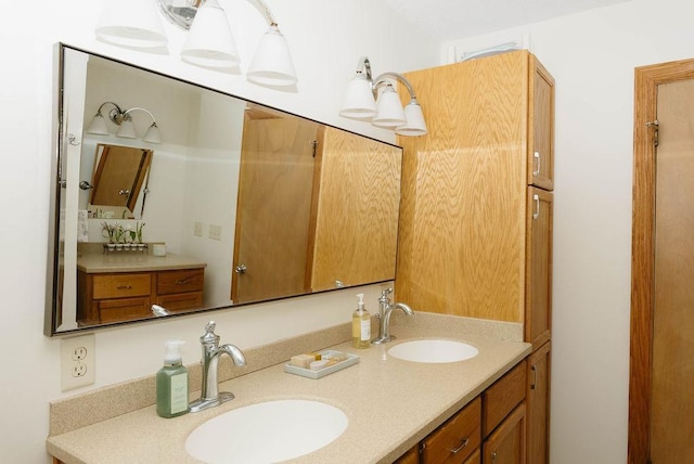 bathroom with double vanity and a sink