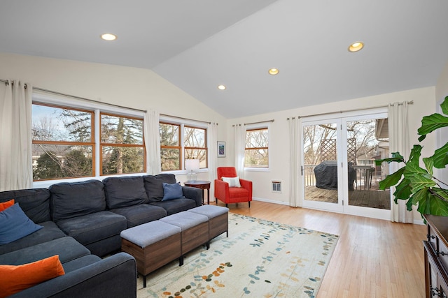 living room featuring light wood-style floors, recessed lighting, vaulted ceiling, and baseboards