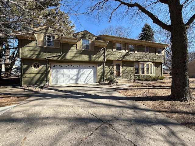 view of front of property with a garage and driveway