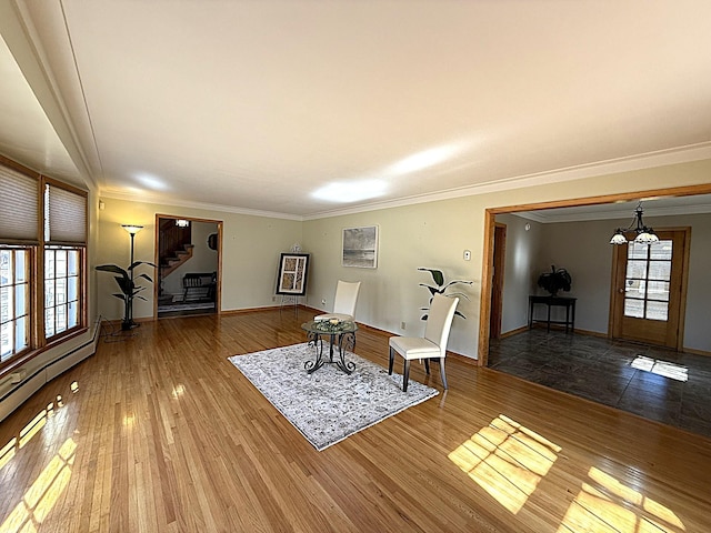 unfurnished room featuring stairway, baseboards, a notable chandelier, and hardwood / wood-style floors