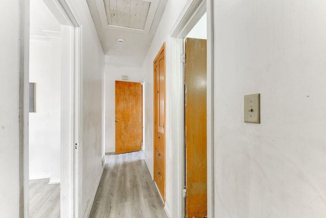 corridor with light wood-style floors