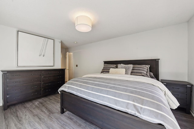 bedroom featuring wood finished floors