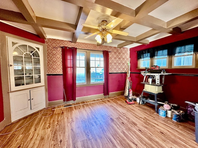 interior space featuring wainscoting, wood finished floors, and wallpapered walls