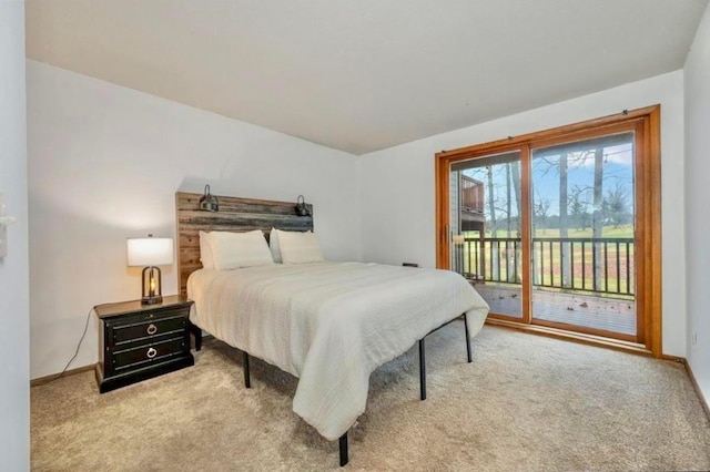 bedroom featuring light carpet, access to outside, and baseboards