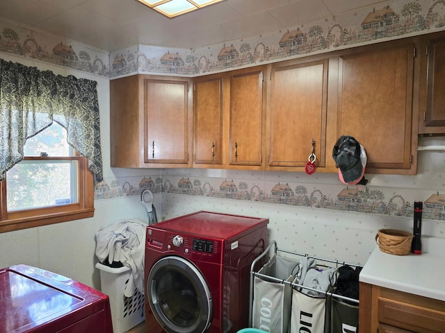 laundry room with cabinet space and washer / clothes dryer