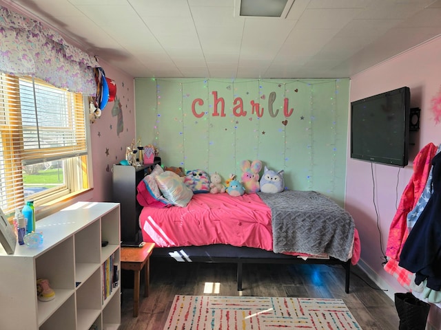 bedroom with wood finished floors