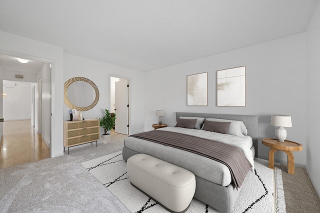 bedroom with light colored carpet