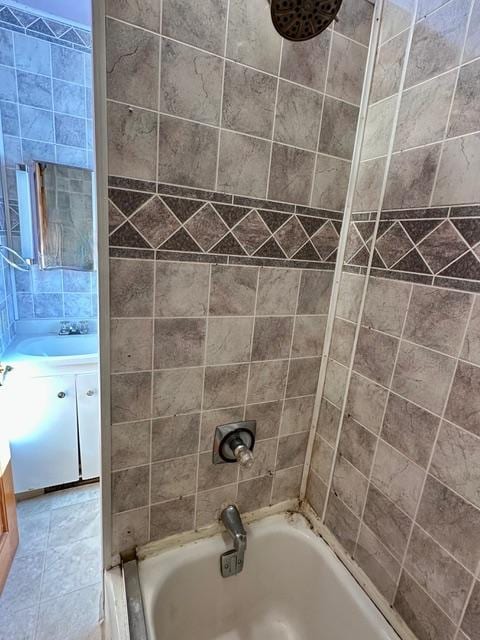 full bath featuring vanity, shower / bathtub combination, and tile patterned floors