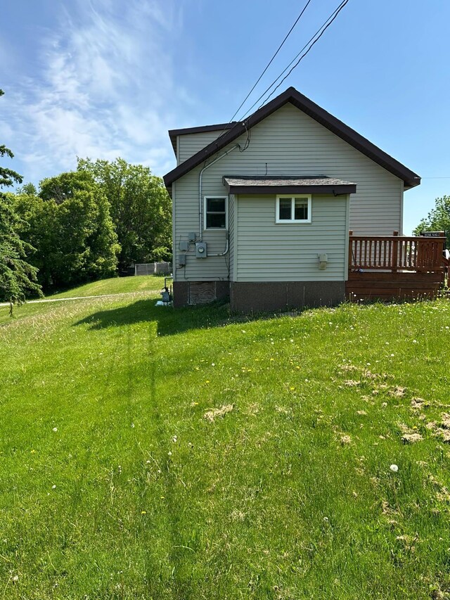 1810 3rd Ave E, International Falls, MN 56649 - rear view of property with a lawn and a deck