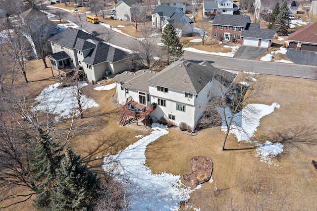 snowy aerial view featuring a residential view