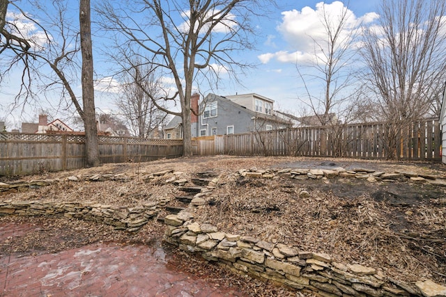 view of yard with a fenced backyard