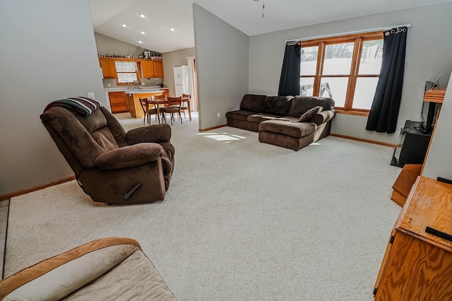 living area featuring recessed lighting, light carpet, vaulted ceiling, and baseboards