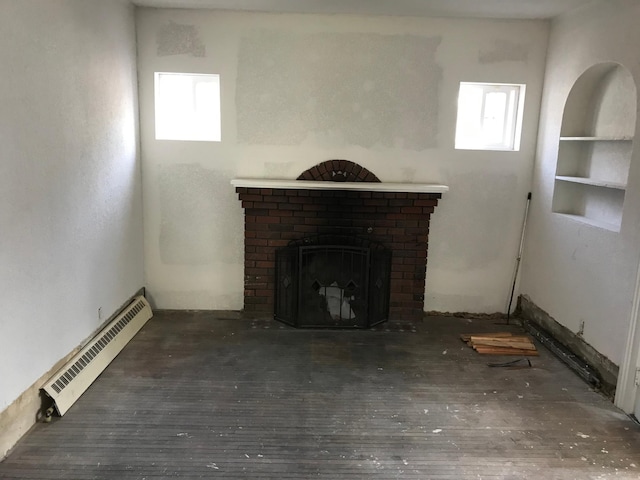 unfurnished living room featuring a baseboard radiator, a fireplace, and wood-type flooring