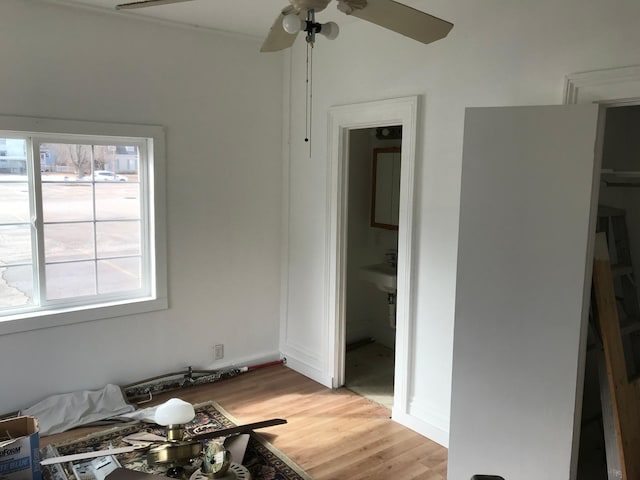 bedroom featuring light wood-style floors and a ceiling fan