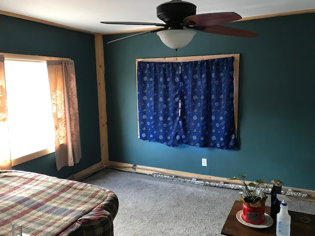 carpeted bedroom featuring a ceiling fan