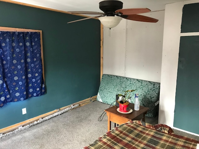 unfurnished bedroom with ceiling fan, carpet floors, and baseboards