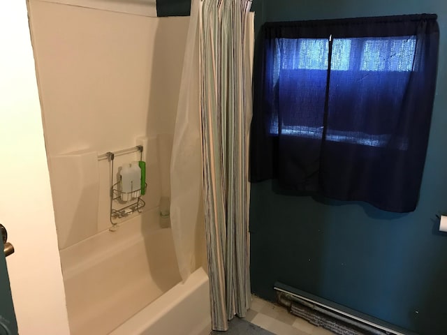 bathroom with shower / tub combo