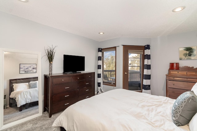 bedroom with light carpet, access to outside, a textured ceiling, and recessed lighting