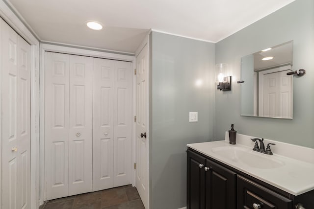 bathroom featuring a closet and vanity