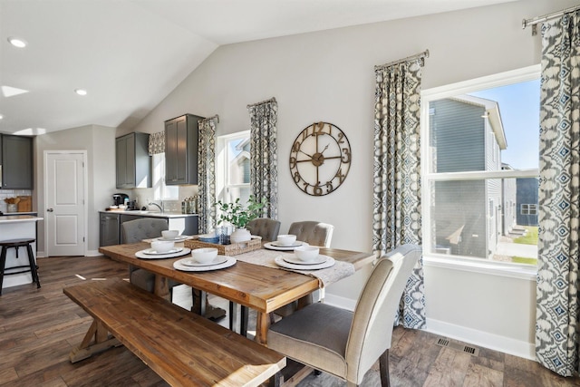 dining area featuring lofted ceiling, recessed lighting, visible vents, baseboards, and dark wood finished floors