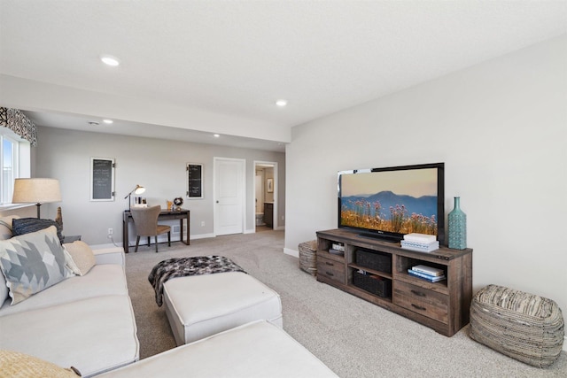 living area with light carpet, baseboards, and recessed lighting