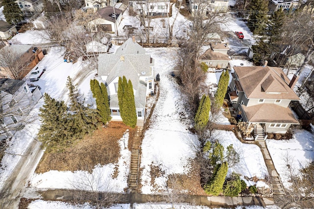 snowy aerial view featuring a residential view