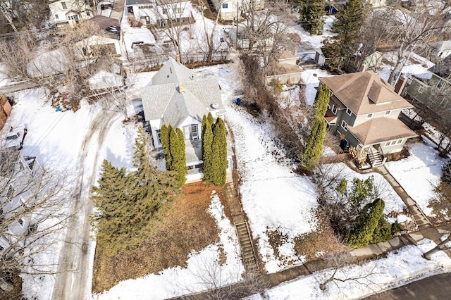 snowy aerial view with a residential view