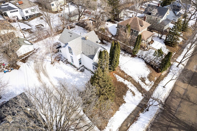 snowy aerial view featuring a residential view