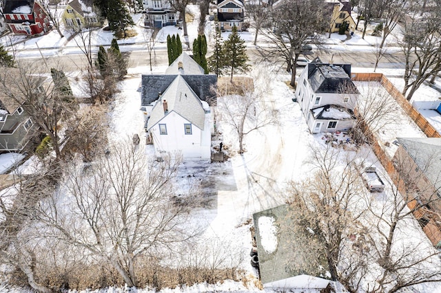 snowy aerial view featuring a residential view