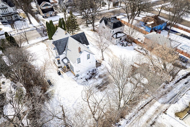 snowy aerial view with a residential view