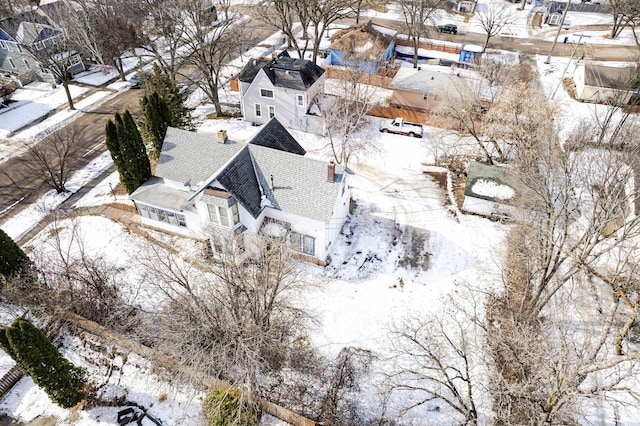 snowy aerial view featuring a residential view