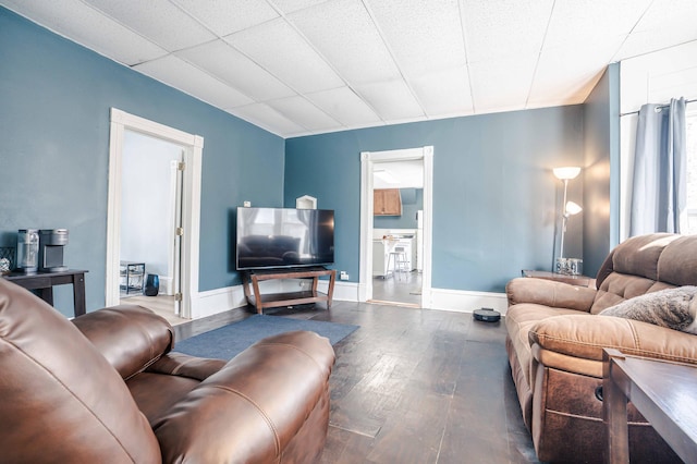 living room with dark wood-type flooring and baseboards