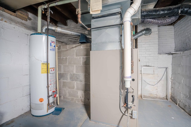 utility room featuring water heater