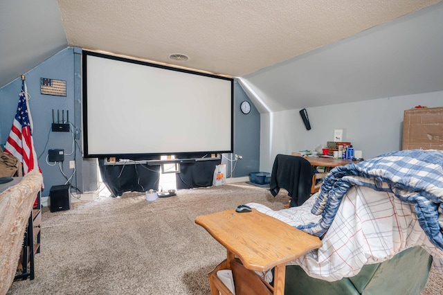 home theater with vaulted ceiling, a textured ceiling, and carpet