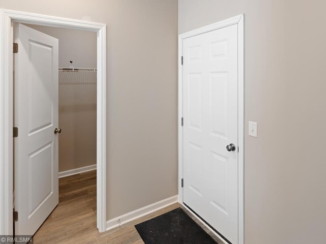 interior space with light wood-style flooring and baseboards