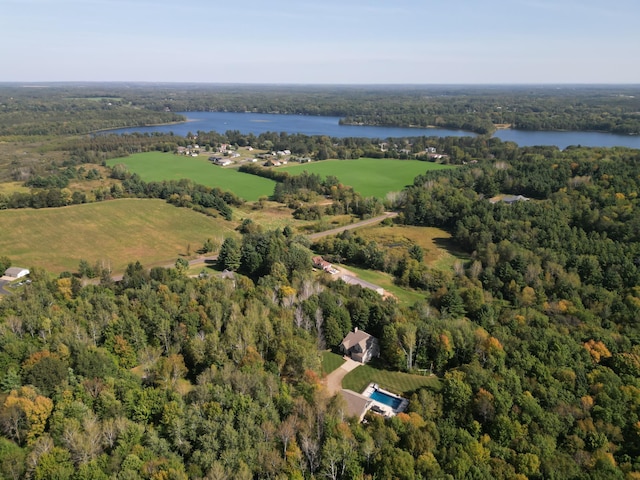 bird's eye view with a water view and a forest view