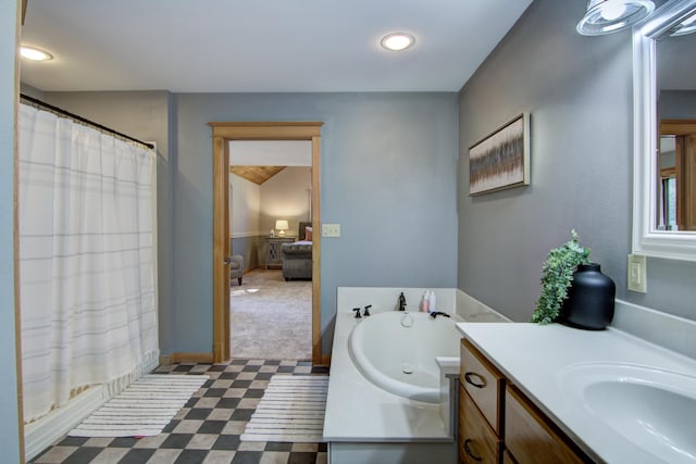 full bathroom featuring vanity, a bathing tub, and a shower with curtain