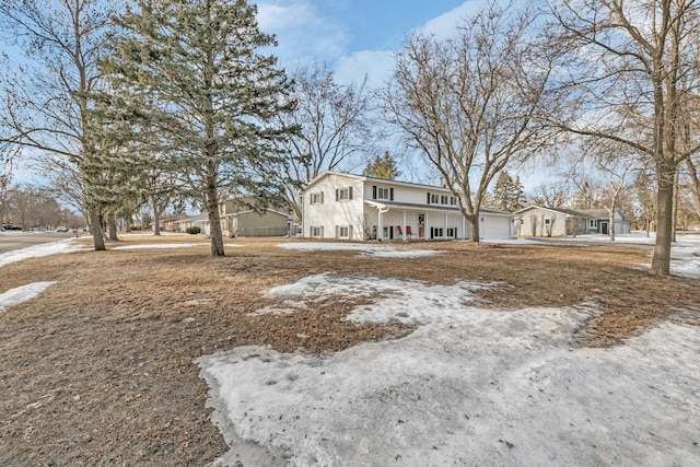 view of front of house featuring a garage and a porch