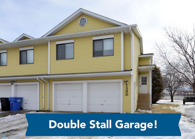 multi unit property featuring a garage