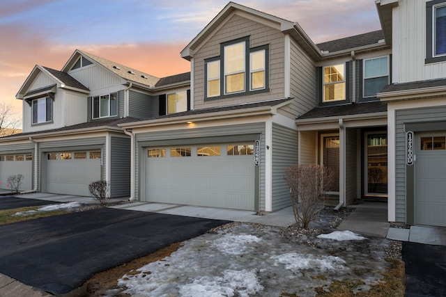 view of front of home with a garage and driveway