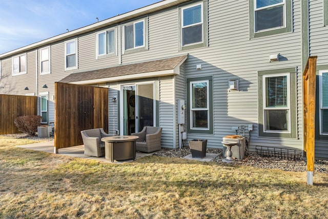 back of house with a patio, central AC unit, a lawn, and fence